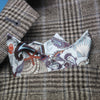 Silk pocket square folded in pocket